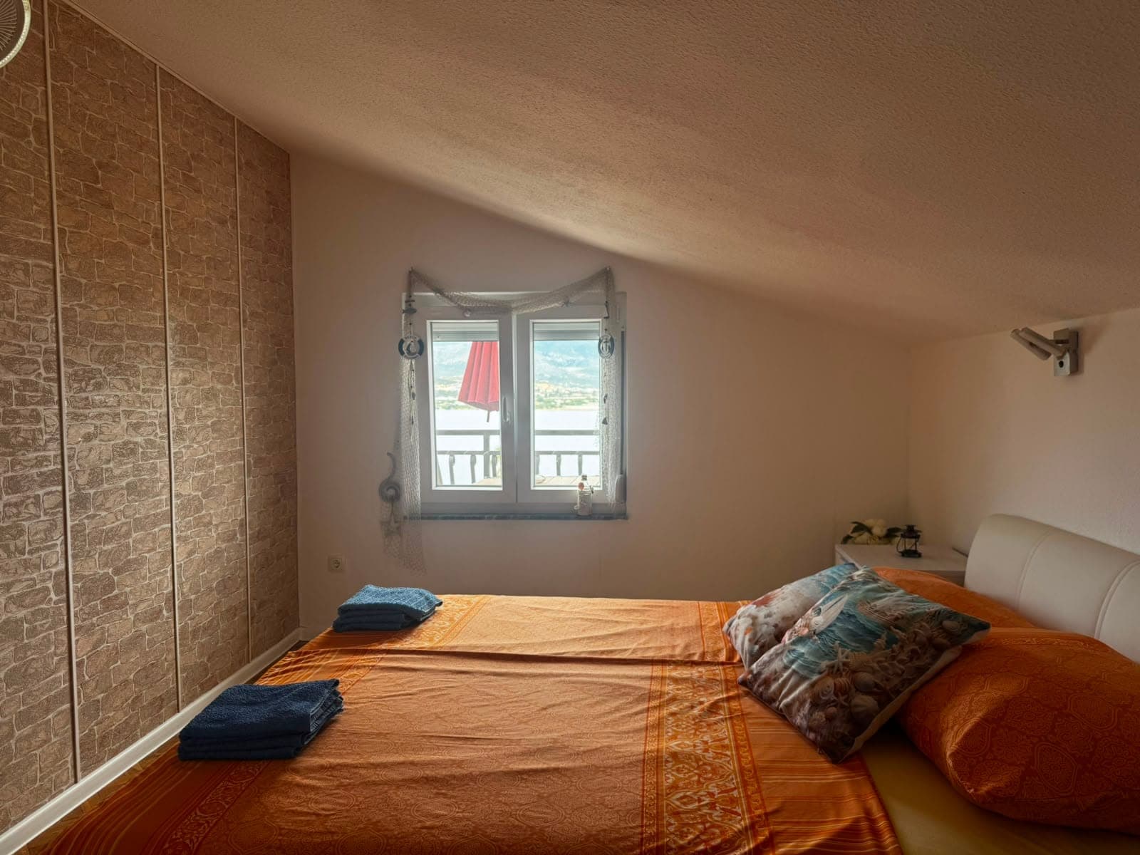Bedroom 1 with double bed and sea view