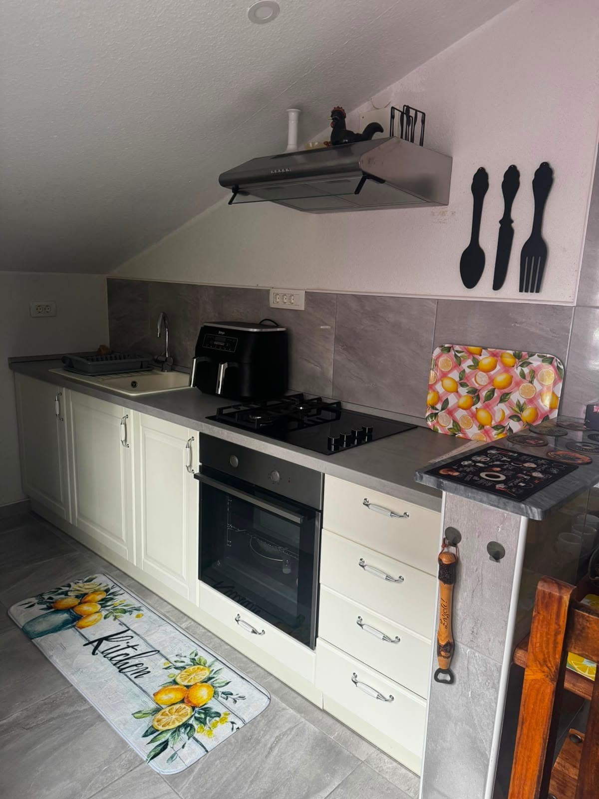 Kitchen counter with stove and oven